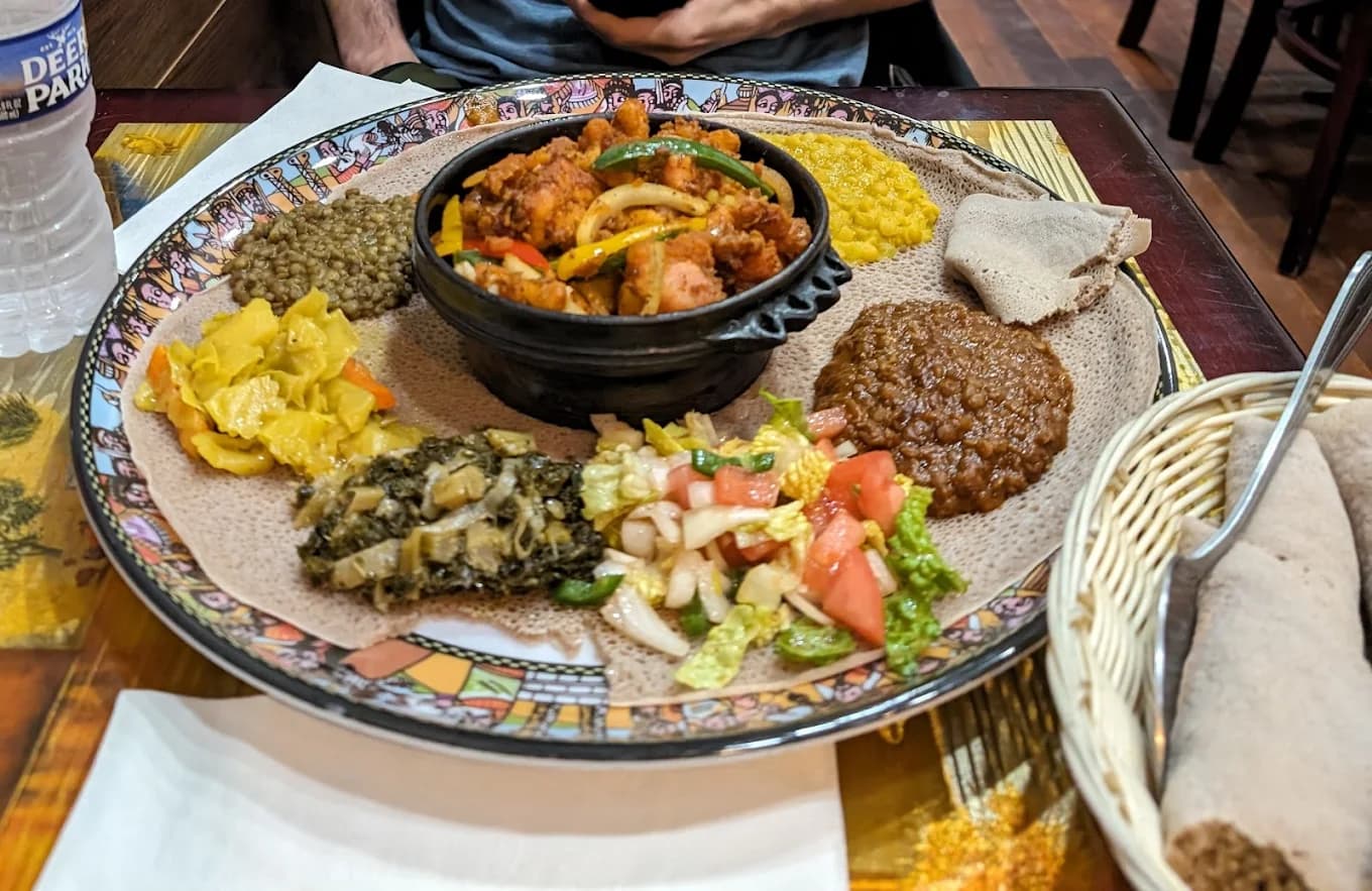 A platter of Ethiopian stews served on injera